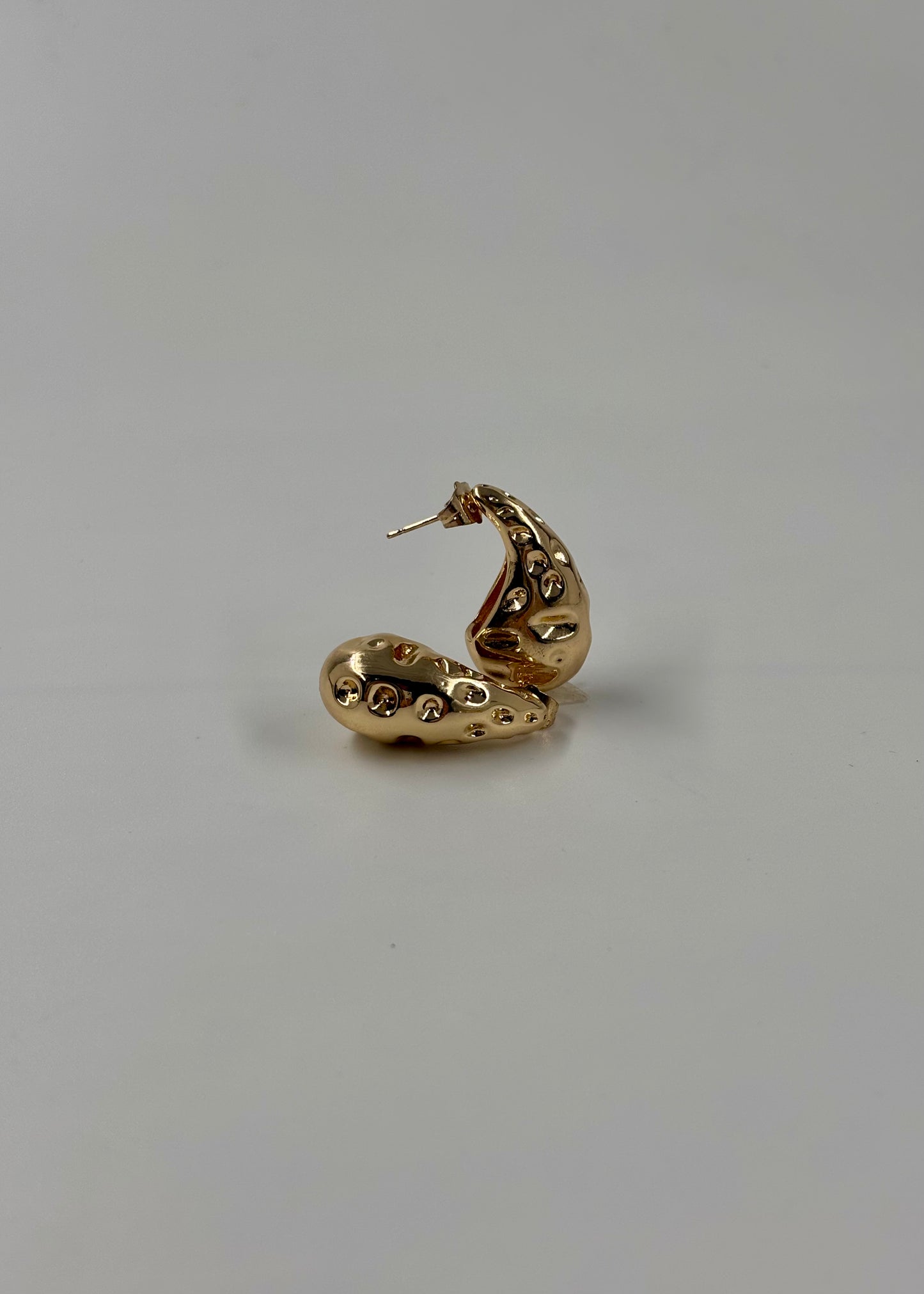 Aretes gota surco