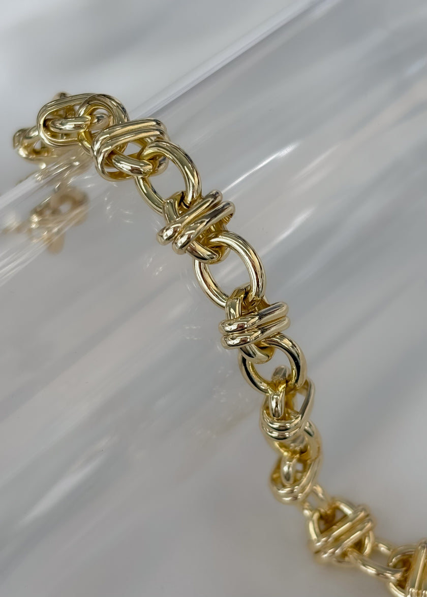 Pulsera dorada círculos cruzados