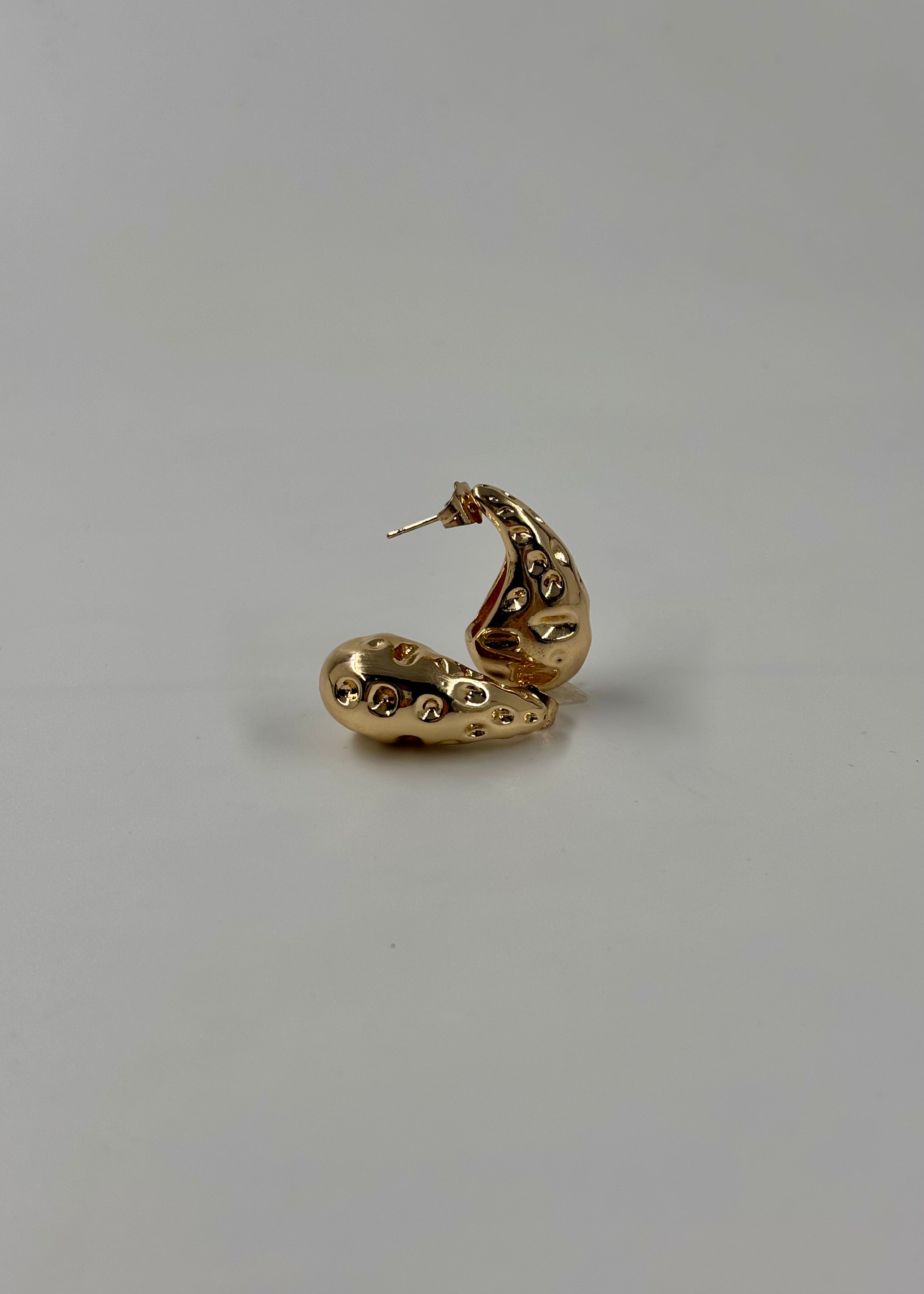 Aretes gota surco