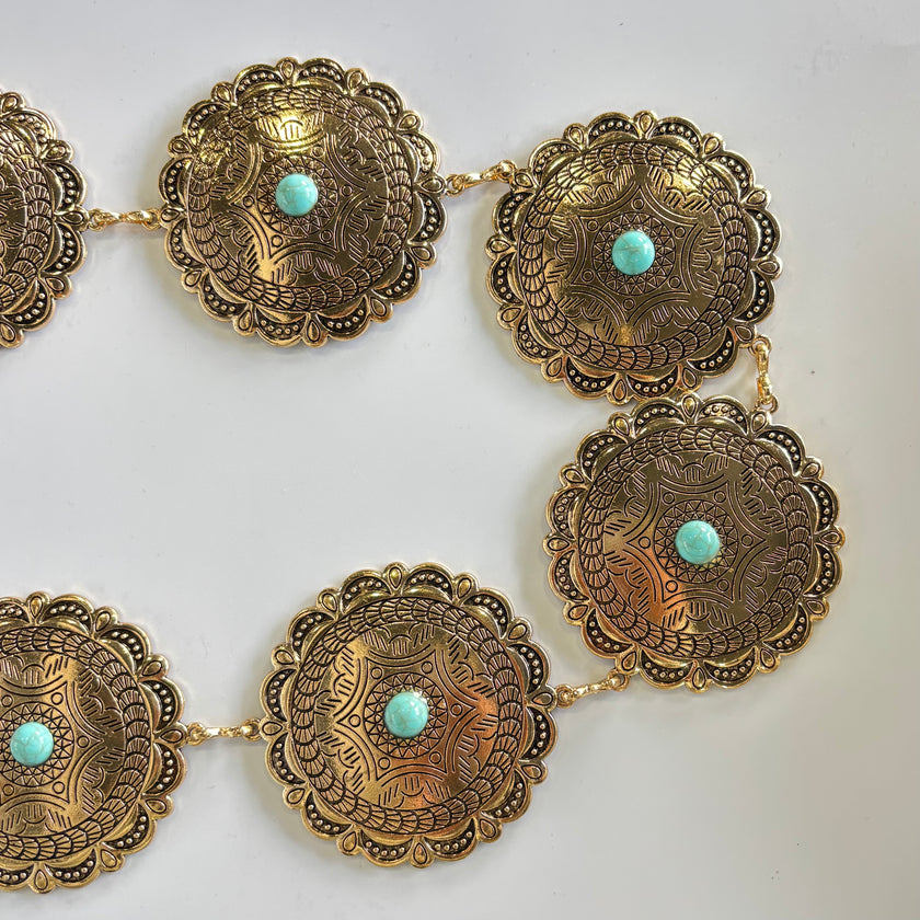 Cinturon metálico flores con punto turquesa