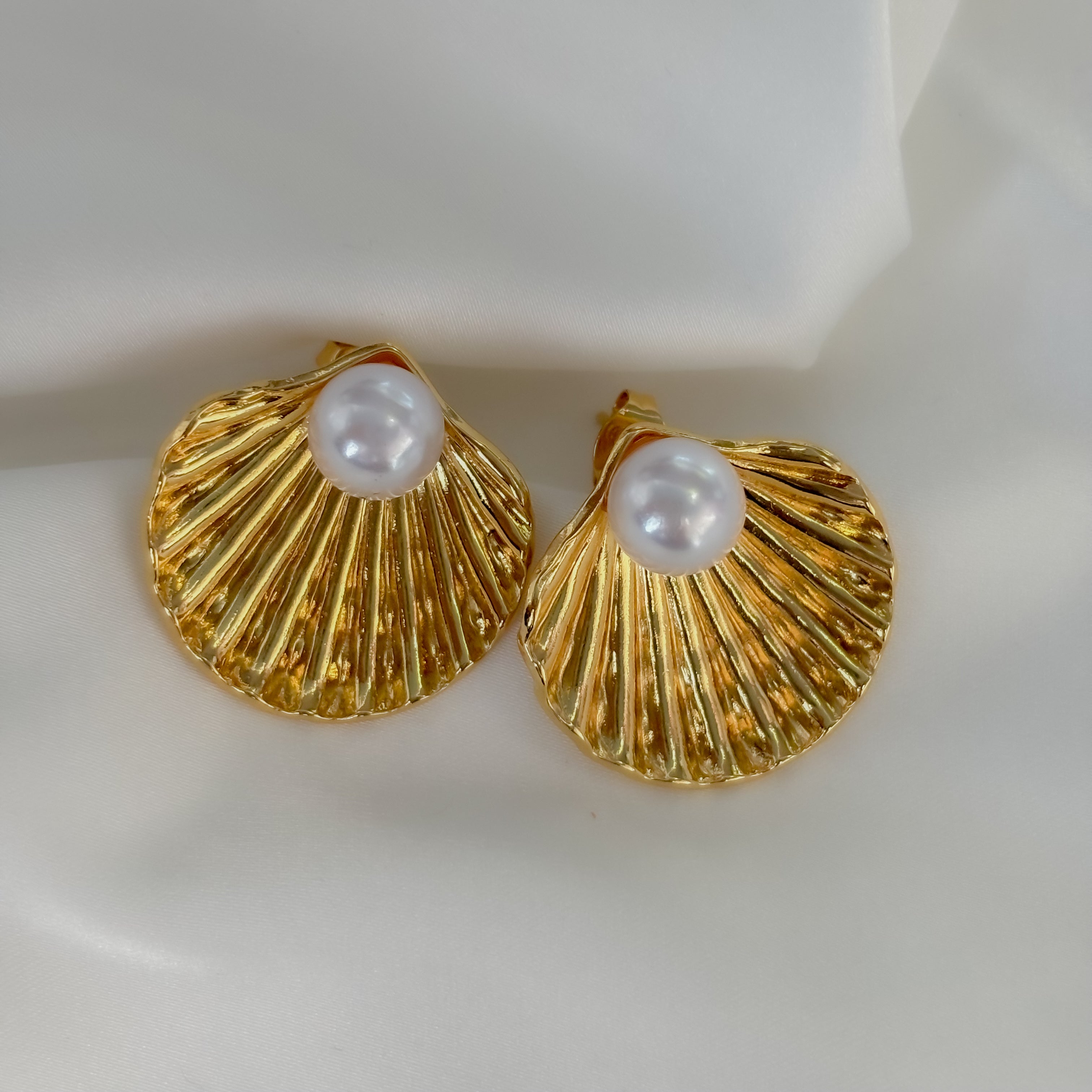 Aretes concha con perla