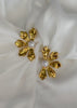 Arete flor incompleta con Perla