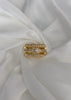 Anillo torcido con brillos en medio