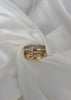 Anillo triple con brillos dobles cruzado