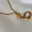 Collar largo con esfera dorada