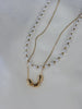 Collar doble perla y figuras