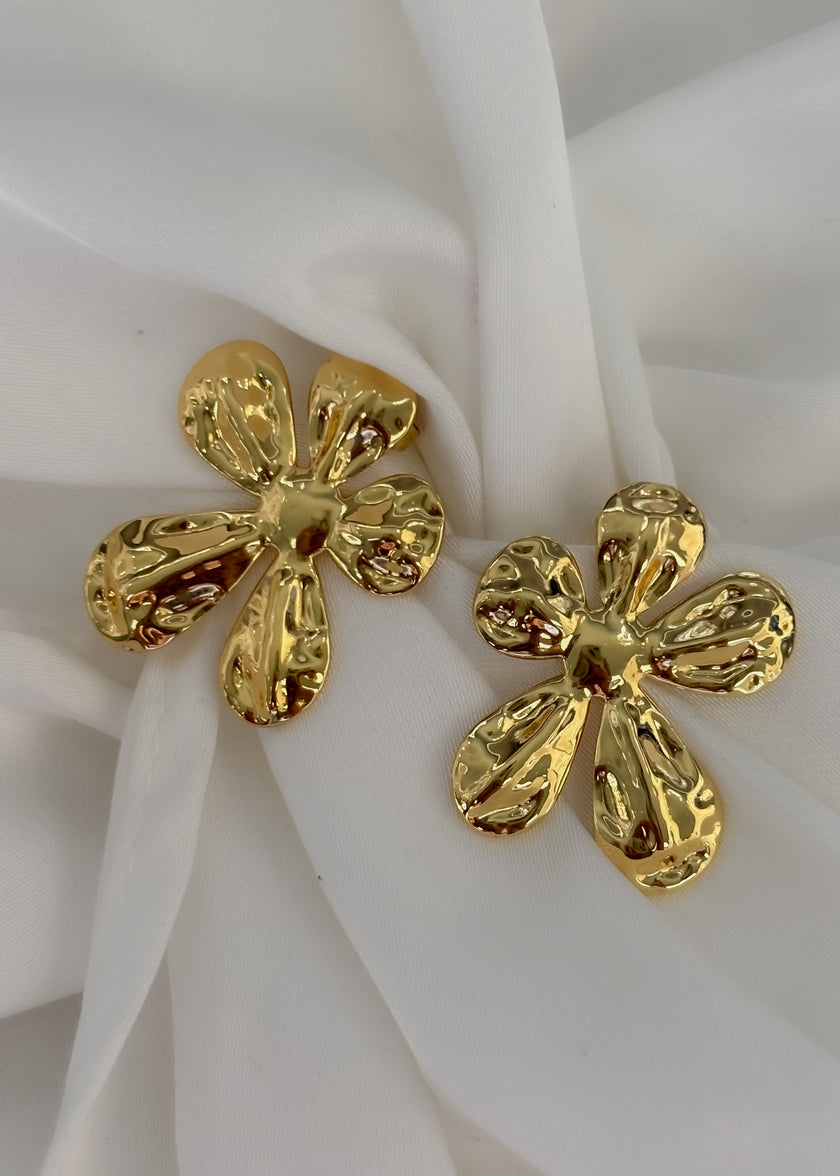 Aretes flor desigual