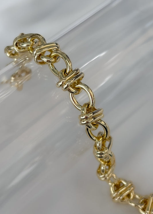 Pulsera dorada círculos cruzados