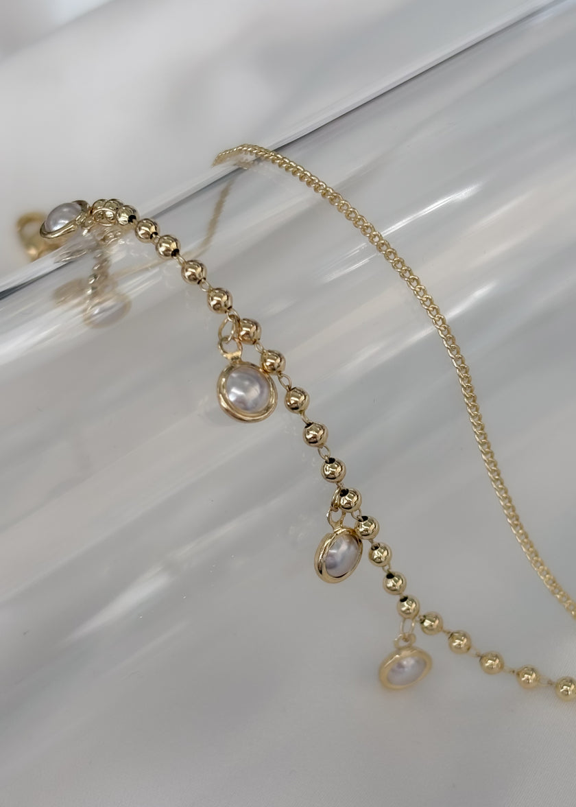 Pulsera doble con pequeñas perlas