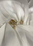 Anillo triple entrelazado con dije destello