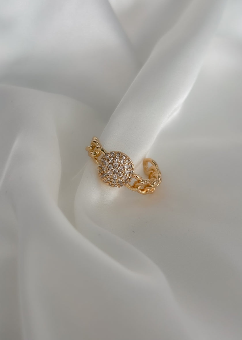 Arete cadena con figura de brillos en medio