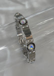 Pulsera plateada con zirconias grandes