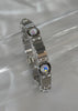 Pulsera plateada con zirconias grandes