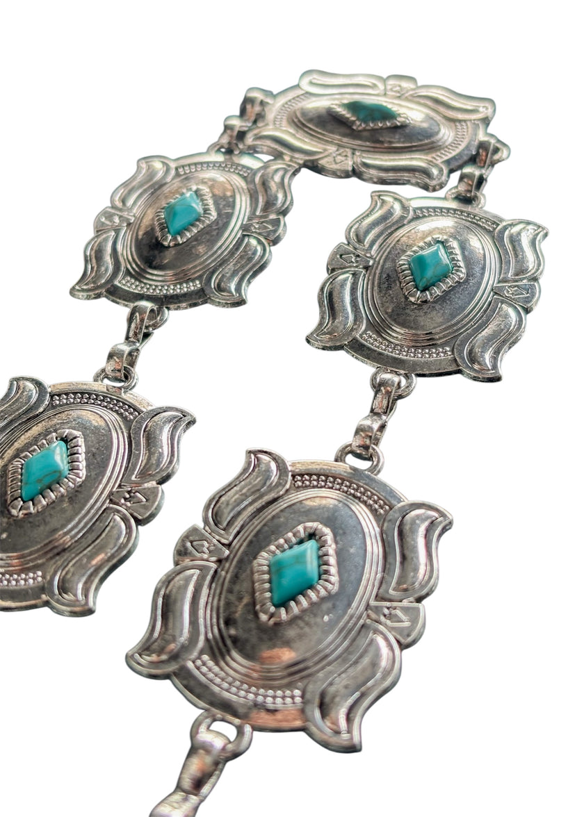 Cinturón metálico plateado con rombo turquesa